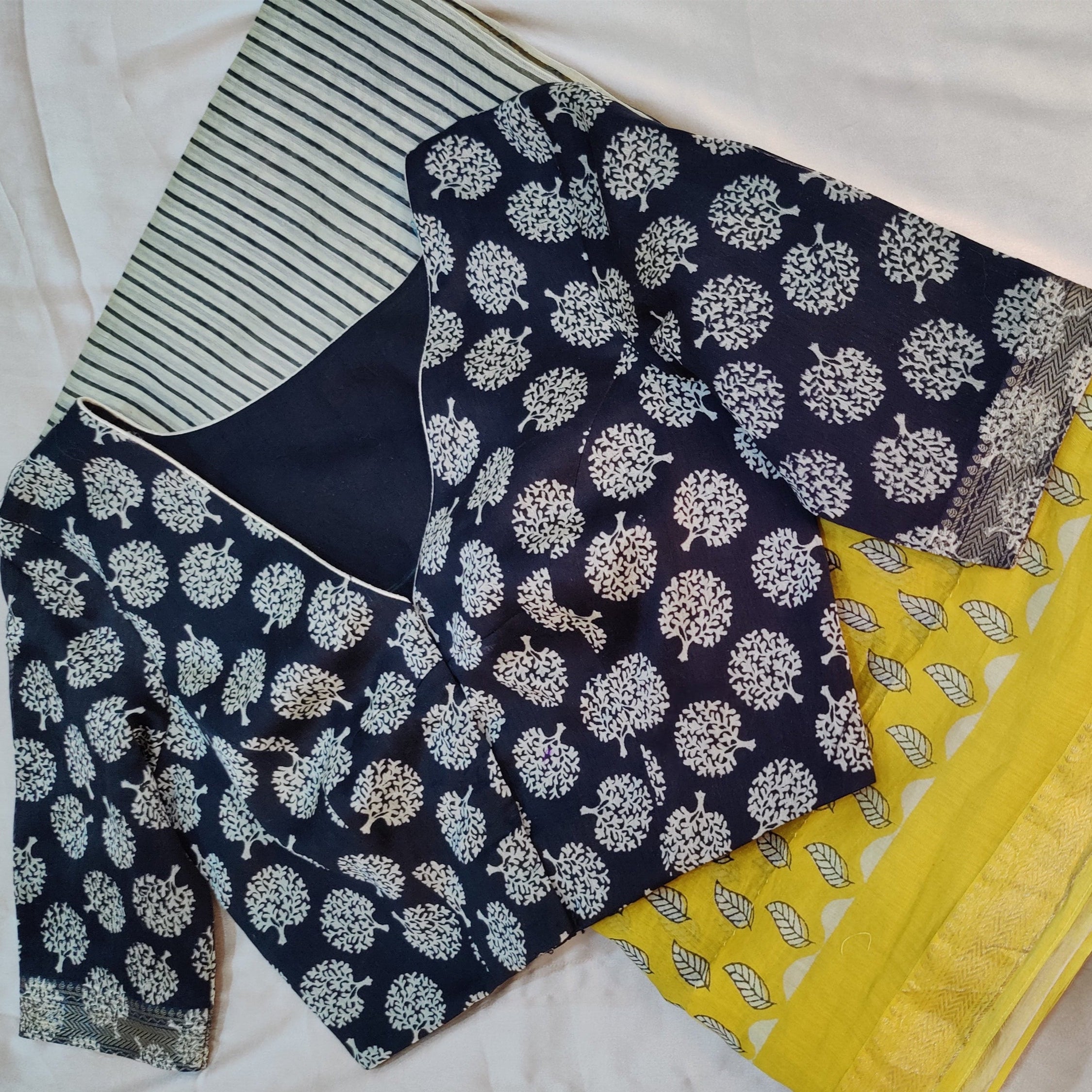 Wide V-shaped neckline in the front  Blouse